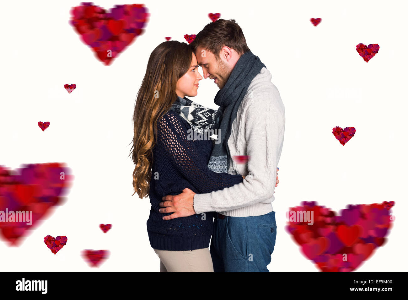 Composite image of side view of young couple embracing Stock Photo