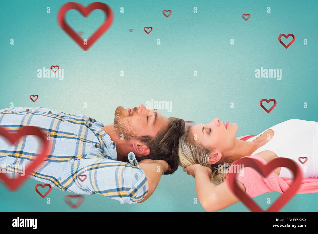 Composite image of attractive young couple sleeping peacefully Stock Photo