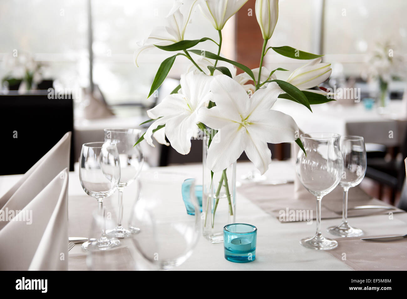 White Lily flowers bridal decoration in glass vase Stock Photo Alamy