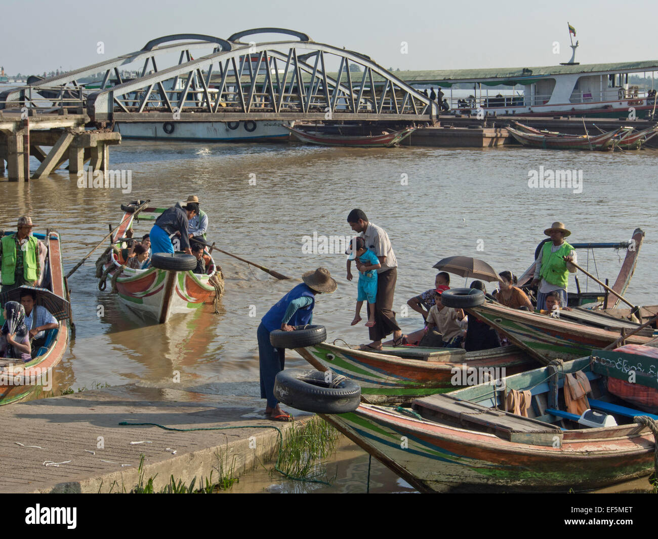 Passenger and fishing boats in the harbour in Yangon, Myanmar Stock