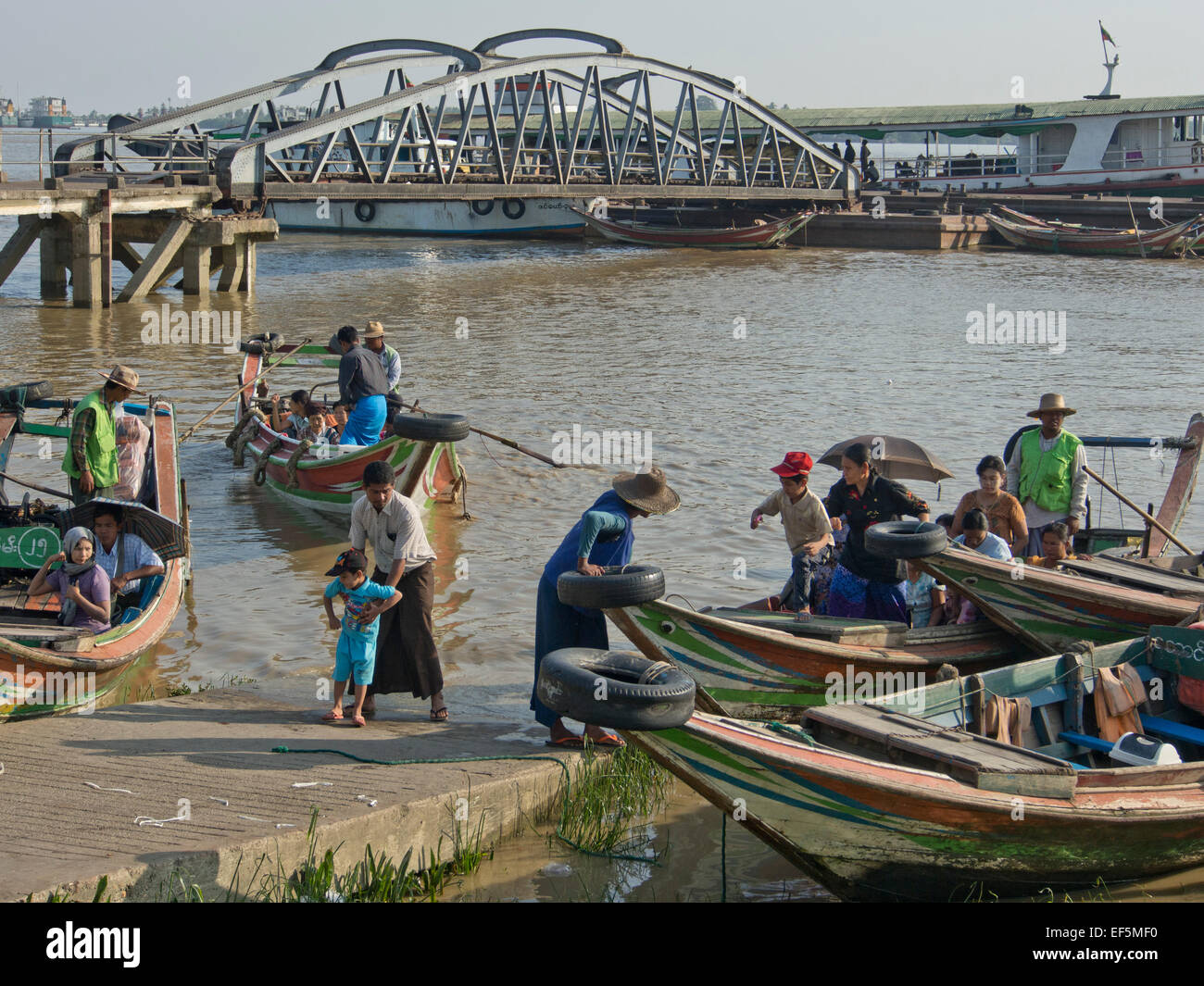Passenger and fishing boats in the harbour in Yangon, Myanmar Stock