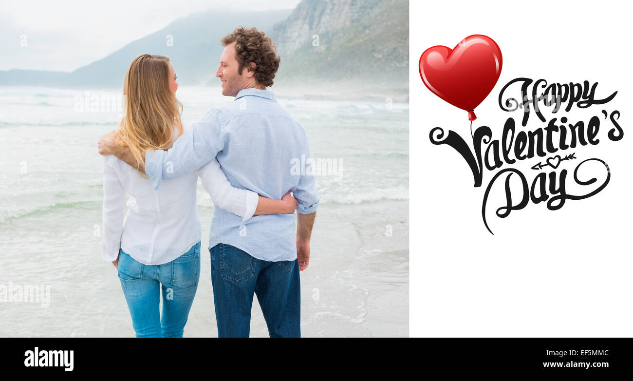 Composite image of rear view of a romantic couple at beach Stock Photo