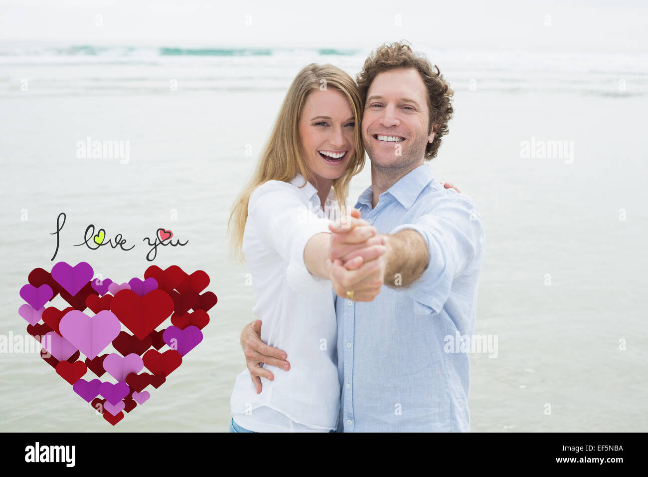 Composite image of portrait of cheerful couple dancing at beach Stock Photo