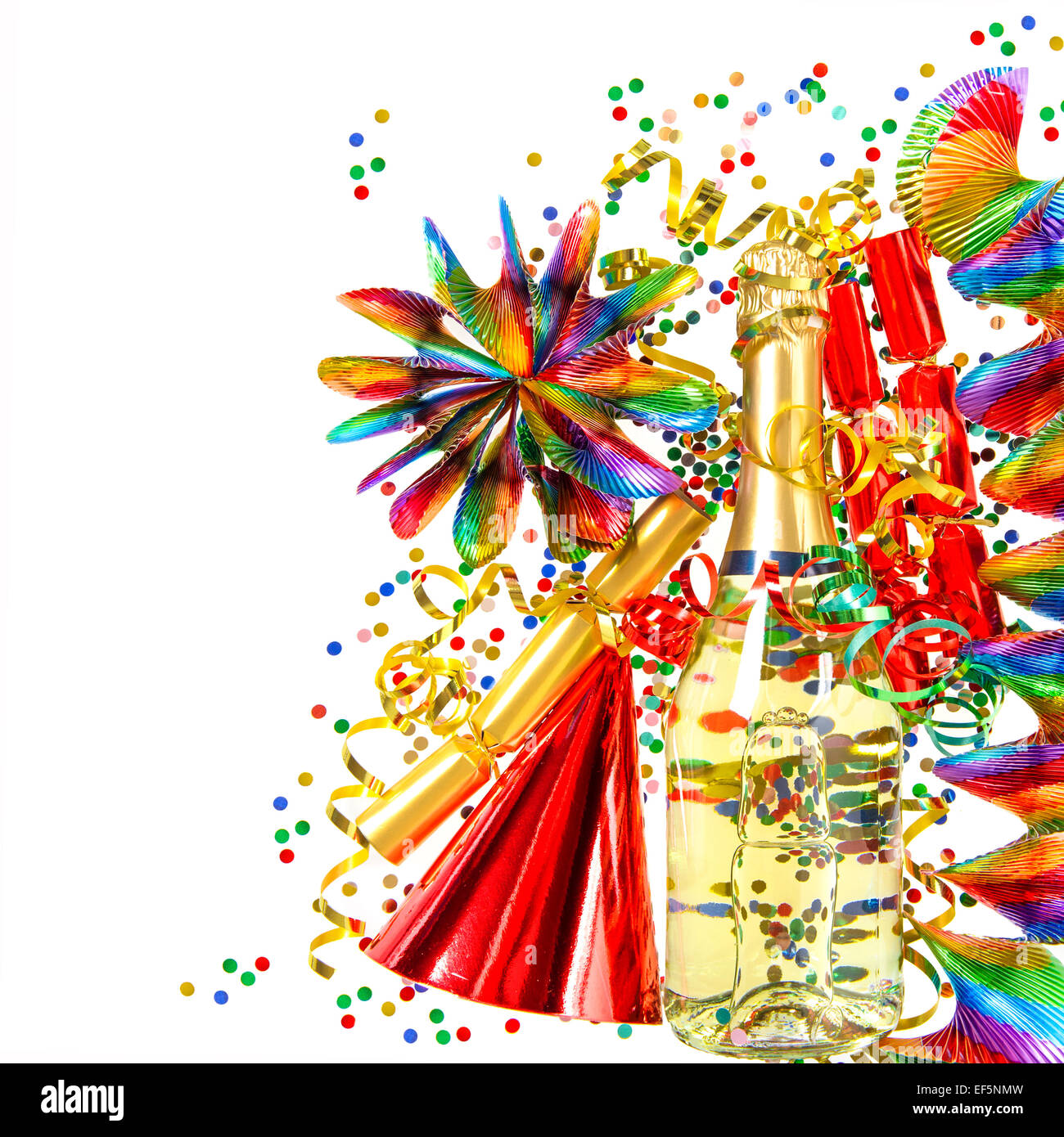 party decoration with garlands, streamer, cracker, confetti and wine bottle. holidays background Stock Photo