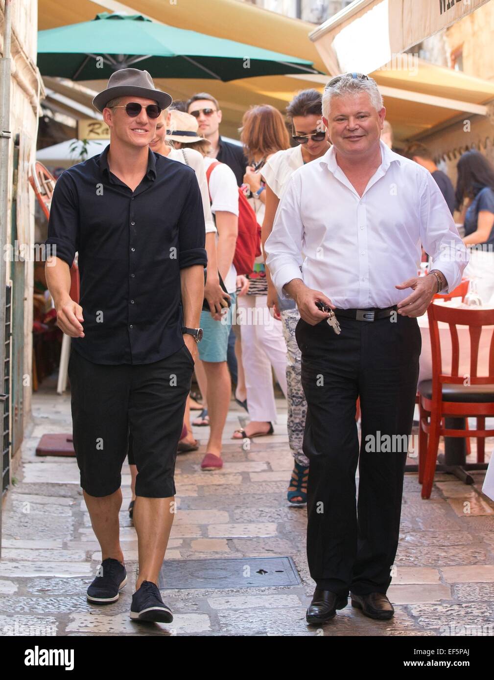 2014 World Cup winner Bastian Schweinsteiger and his girlfriend, Sarah Brandner are shown around the city of Dubrovnik, along with former Croatian defender Robert Kovac and his wife Anica, by Mayor Andro Vlahusic.  Featuring: Bastian Schweinsteiger,Andro Vlahusic Where: Dubrovnik, Croatia When: 25 Jul 2014 Stock Photo
