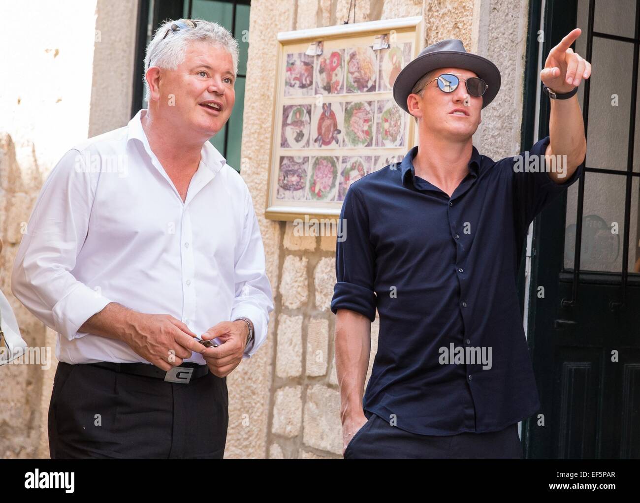 2014 World Cup winner Bastian Schweinsteiger and his girlfriend, Sarah Brandner are shown around the city of Dubrovnik, along with former Croatian defender Robert Kovac and his wife Anica, by Mayor Andro Vlahusic.  Featuring: Bastian Schweinsteiger,Andro Vlahusic Where: Dubrovnik, Croatia When: 25 Jul 2014 Stock Photo