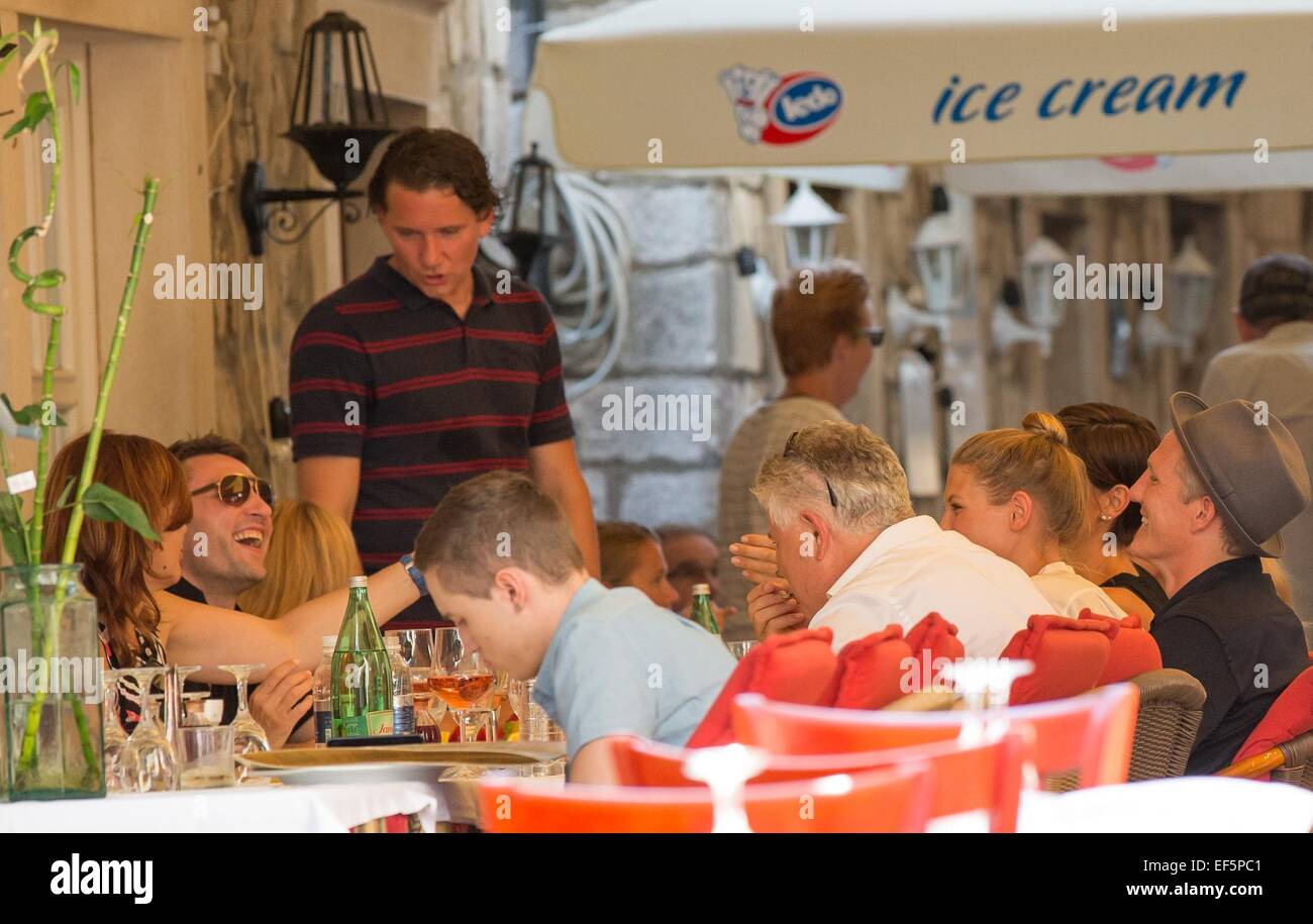 2014 World Cup winner Bastian Schweinsteiger and his girlfriend, Sarah Brandner are shown around the city of Dubrovnik, along with former Croatian defender Robert Kovac and his wife Anica, by Mayor Andro Vlahusic.  Featuring: Bastian Schweinsteiger,Robert Kovac,Anica Kovac Where: Dubrovnik, Croatia When: 25 Jul 2014 Stock Photo