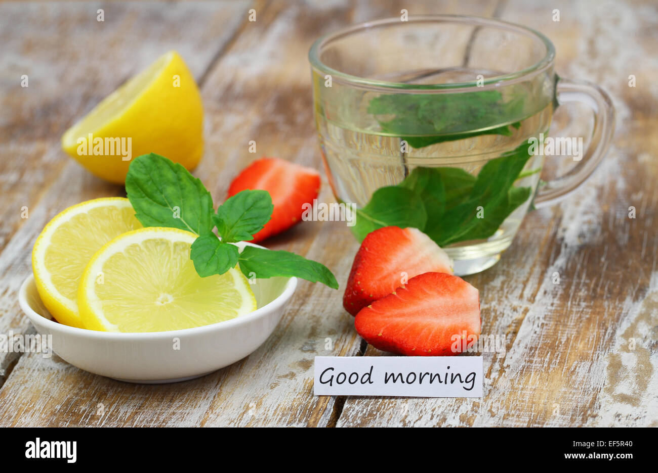 Good morning card with strawberries, mint tea and lemon Stock Photo