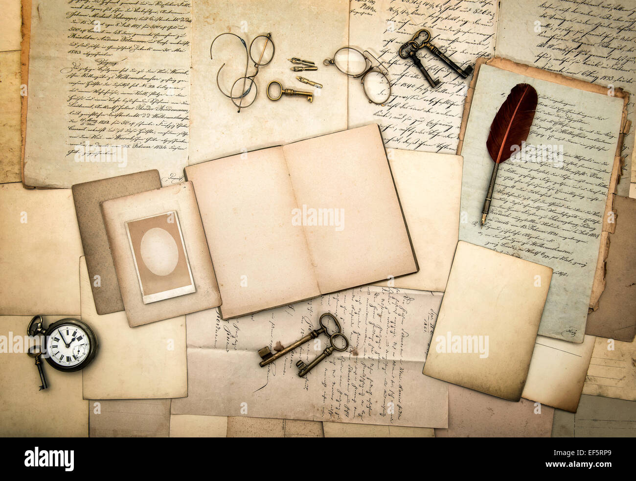 open diary book, old letters, picture frames, vintage accessories and office supplies. nostalgic background Stock Photo