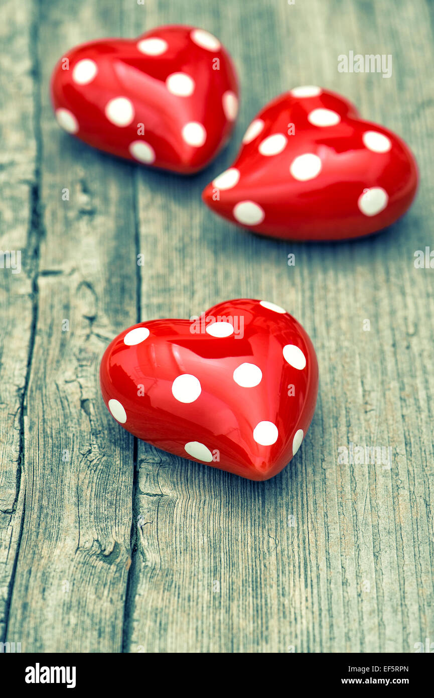 Red Hearts On Wooden Background. Valentines Day Concept. Vintage style toned picture Stock Photo