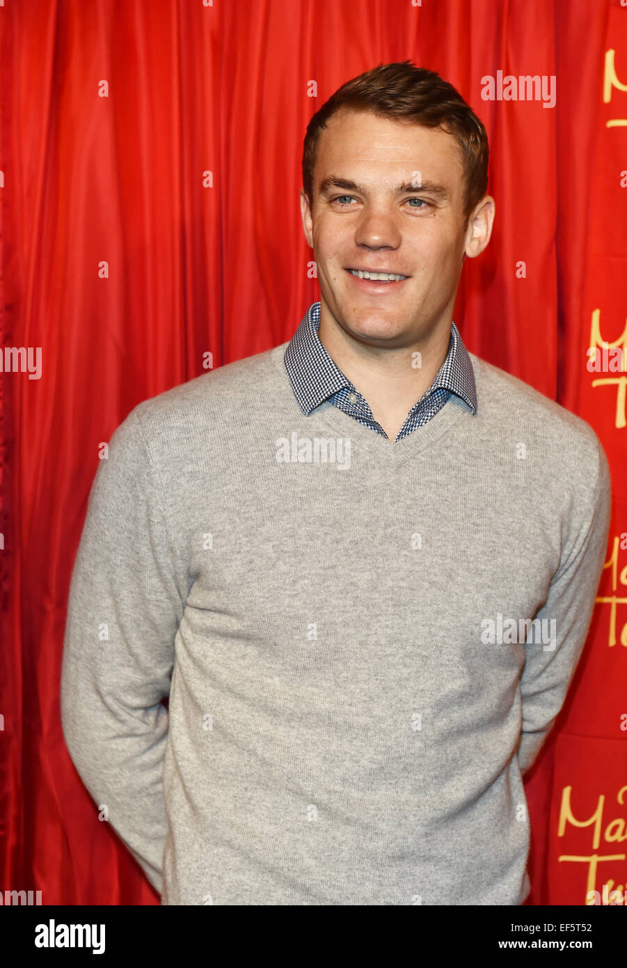 Berlin, Germany. 26th January, 2015. Manuel Neuer, goalkeeper for the national soccer team, poses next to his wax figure (not pictured) at Madame Tussauds in Berlin, Germany, 26 January 2015. It cost 200,000 Euros to make the figure, which can be seen in the sport section of the wax museum starting Tuesday, 27 January 2015. Photo: JENS KALAENE/dpa/ Alamy Live News Stock Photo