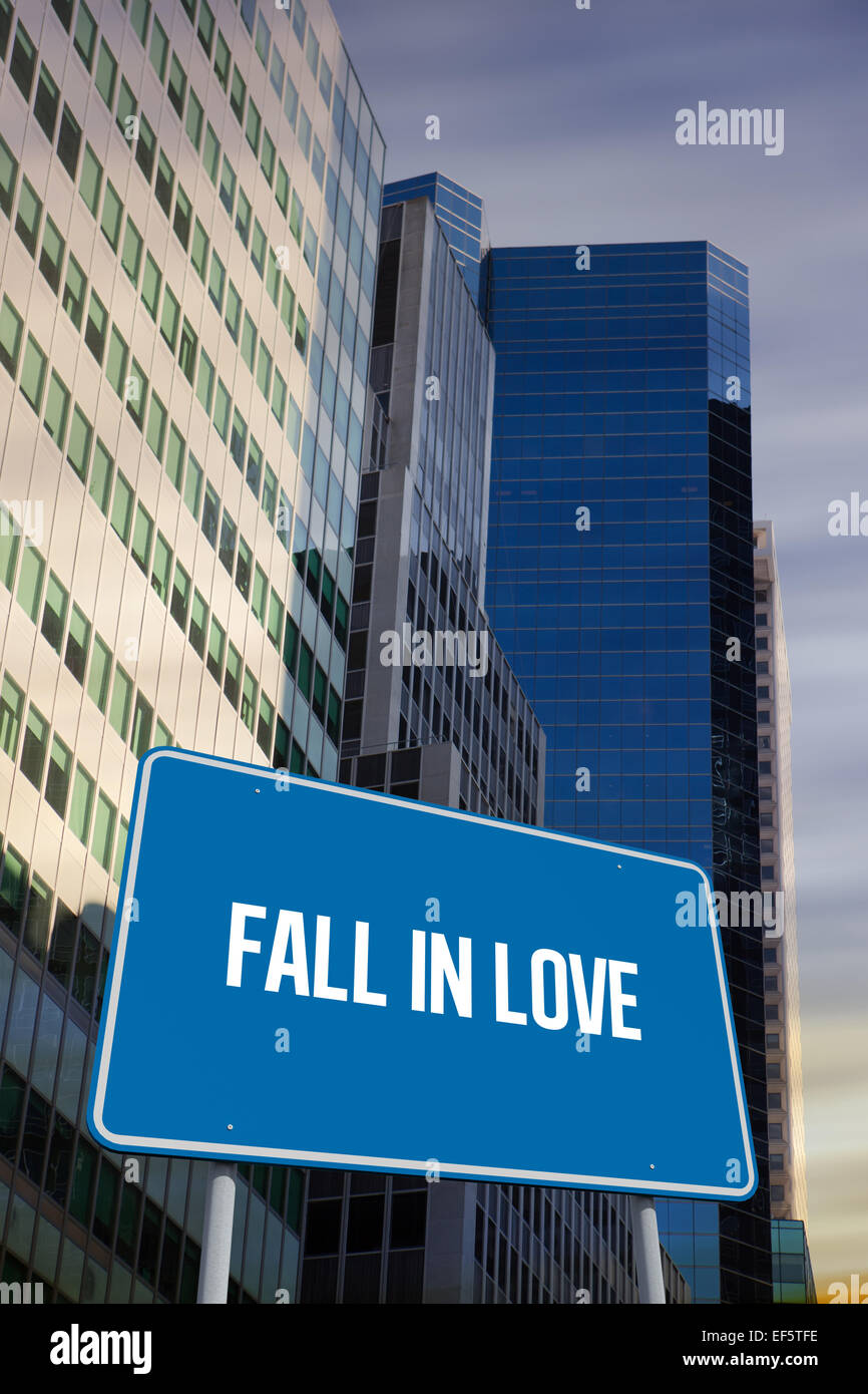 Fall in love against low angle view of skyscrapers Stock Photo