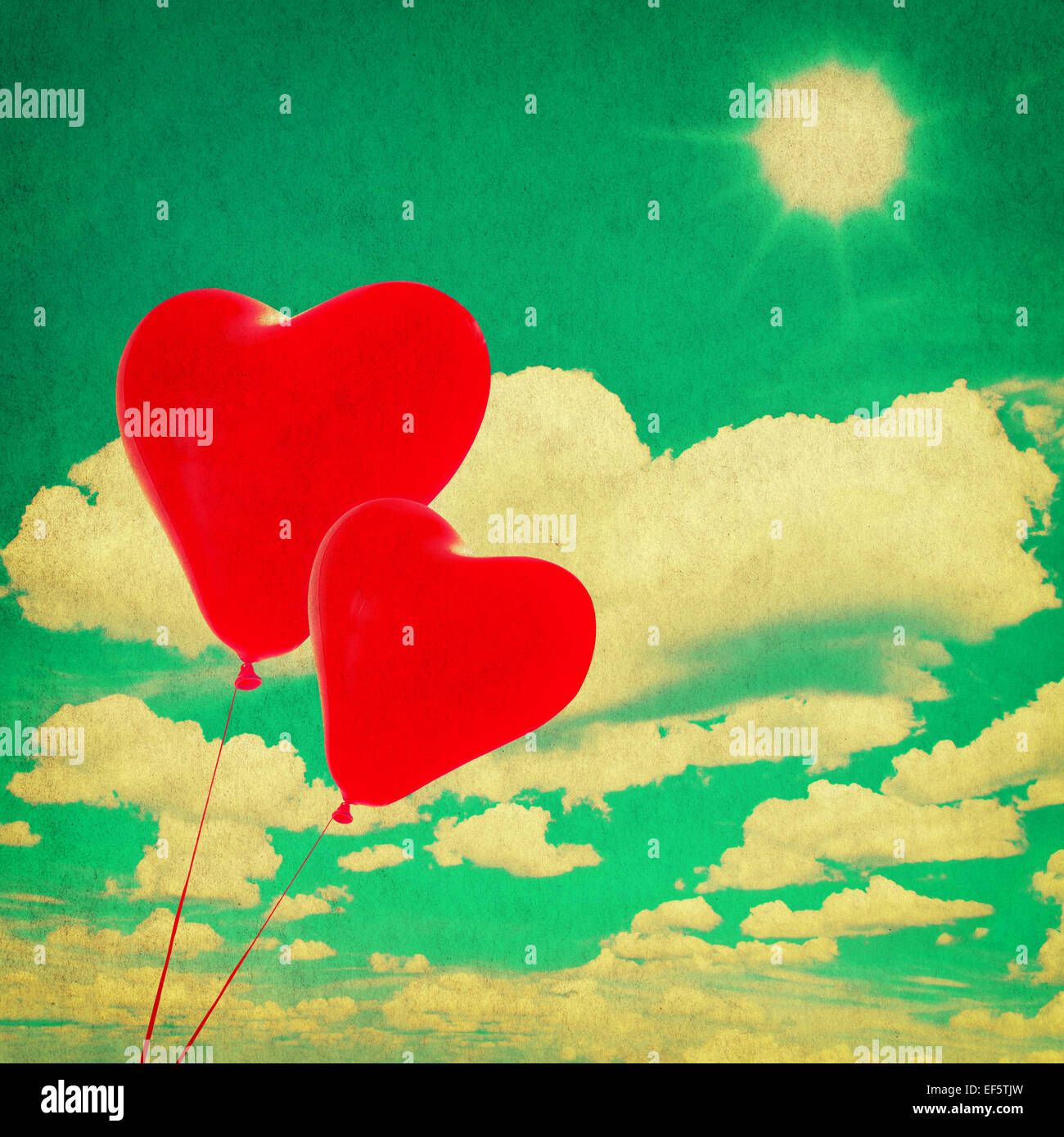perfect blue sky with white clouds and red heart shaped balloons ...