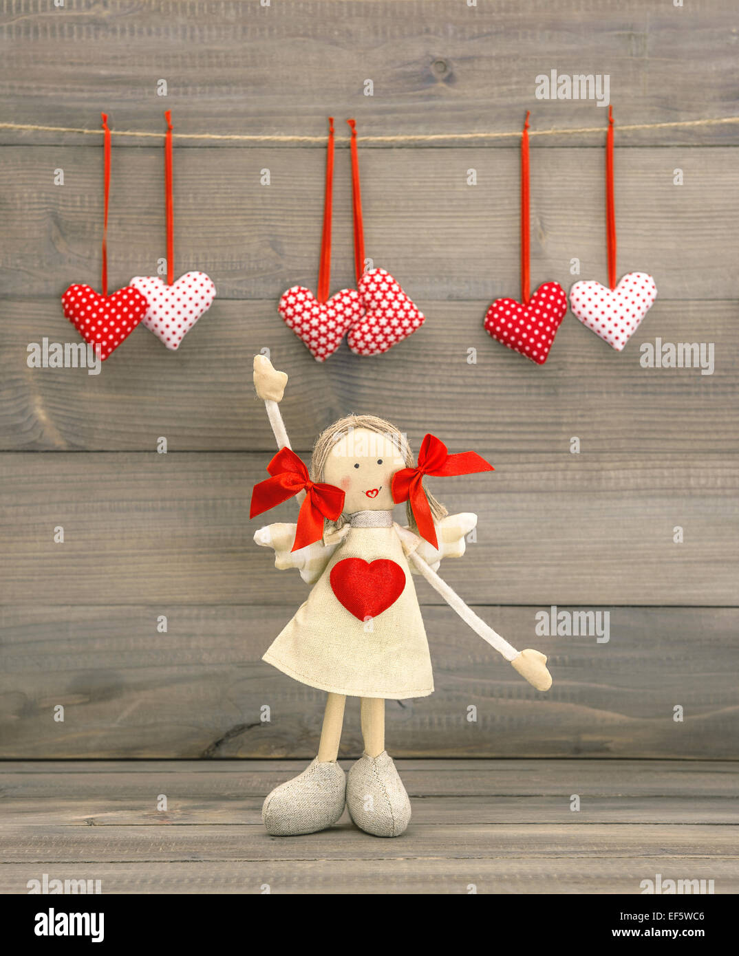 Cute Girl with Red Heart. Lovely Valentines Day decoration Stock Photo
