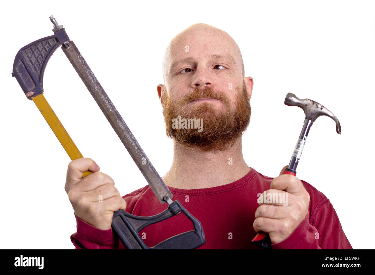 silly man holding hammer and saw in his hands Stock Photo
