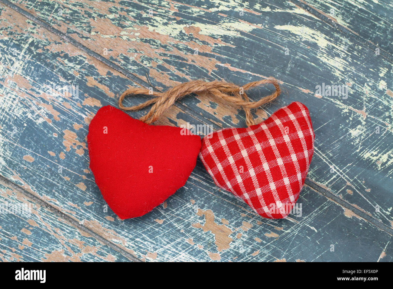 Two hearts on rustic wooden surface Stock Photo