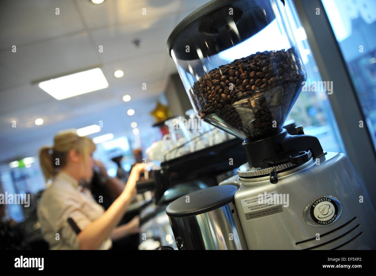 Coffee grinder and barista in a cafe, Leeds. Stock Photo