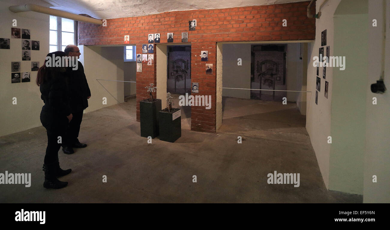 Bernburg, Germany. 27th Jan, 2015. Two visitors stand in the former crematorium in the memorial NS-'Euthanasie' photographed in Bernburg, Germany, 27 January 2015. Around 14,000 sick, handicapped, and socially conspicuous people were murdered with gas, drugs, and food deprivation through the cooperation of doctors, jurists, nursing staff and administration between 1940 and 1943. PHOTO: JENS WOLF/dpa/Alamy Live News Stock Photo