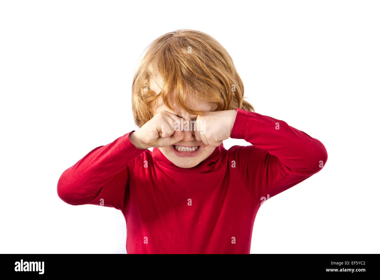 tired child rubbing his eyes isolated Stock Photo Alamy