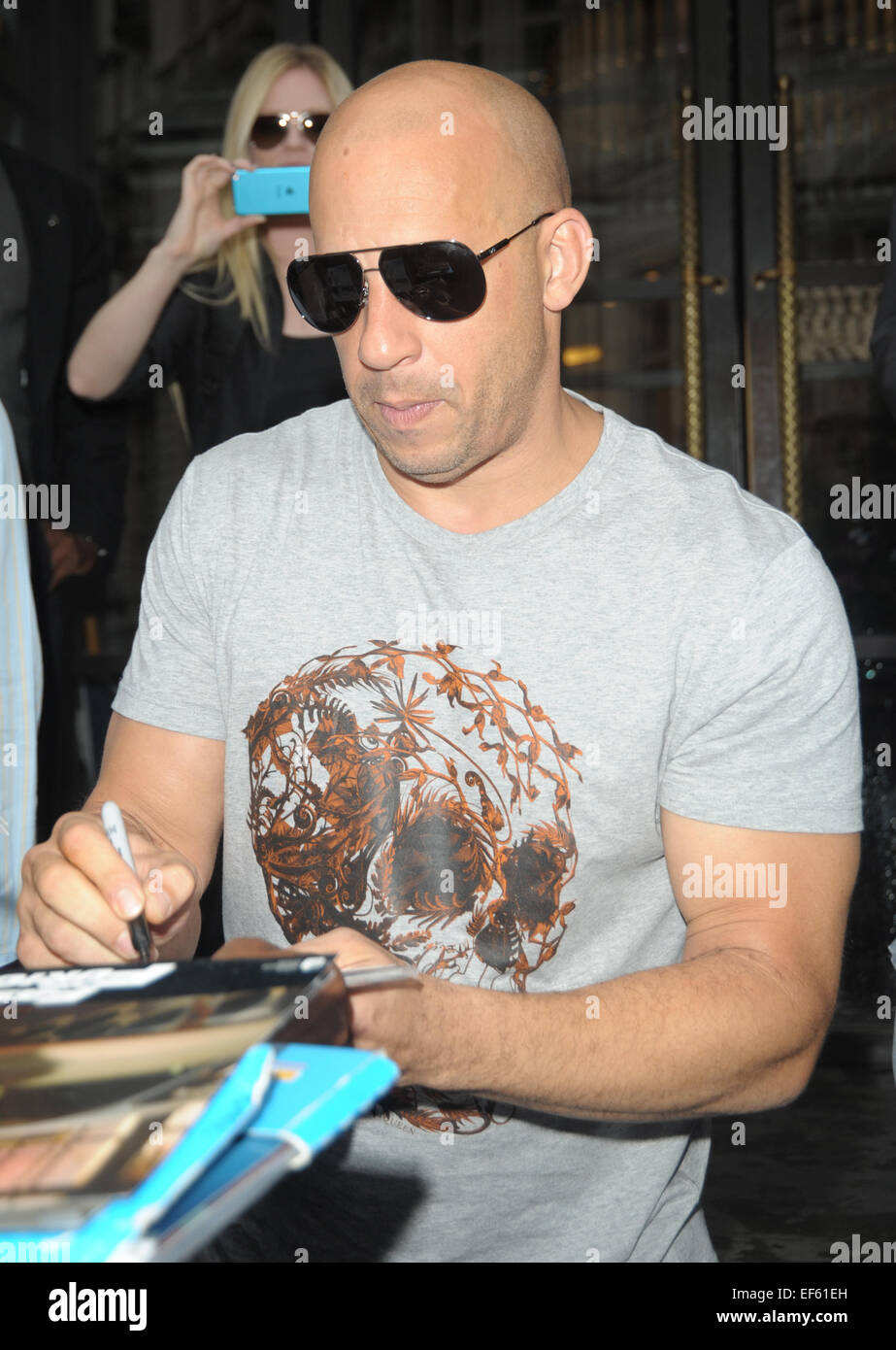 Vin Diesel signs autographs for fans as he leaves the Corinthia Hotel