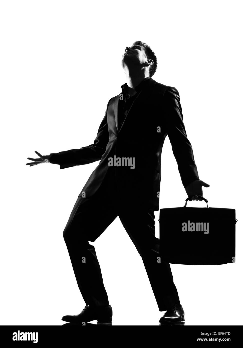 silhouette caucasian business man  expressing anger adversity despair looking up behavior full length on studio isolated white background Stock Photo