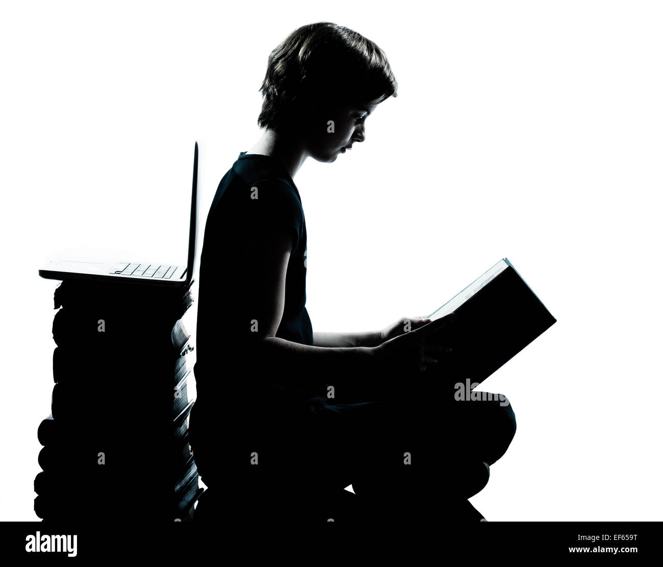 one caucasian young teenager silhouette boy or girl reading full length in studio cut out isolated on white background Stock Photo