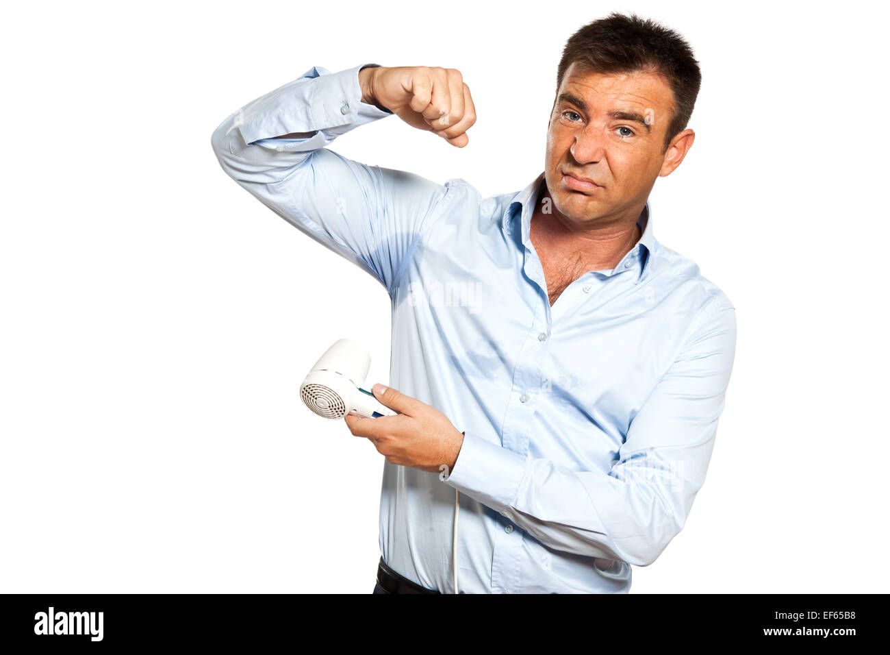 One Caucasian Man With Sweat Stain Perspire Drying Shirt With Hair Dryer In Studio Isolated On 