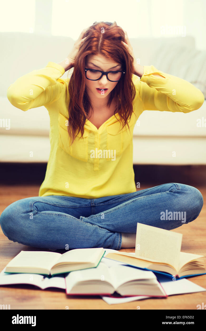 smiling student girl reading books at home Stock Photo - Alamy