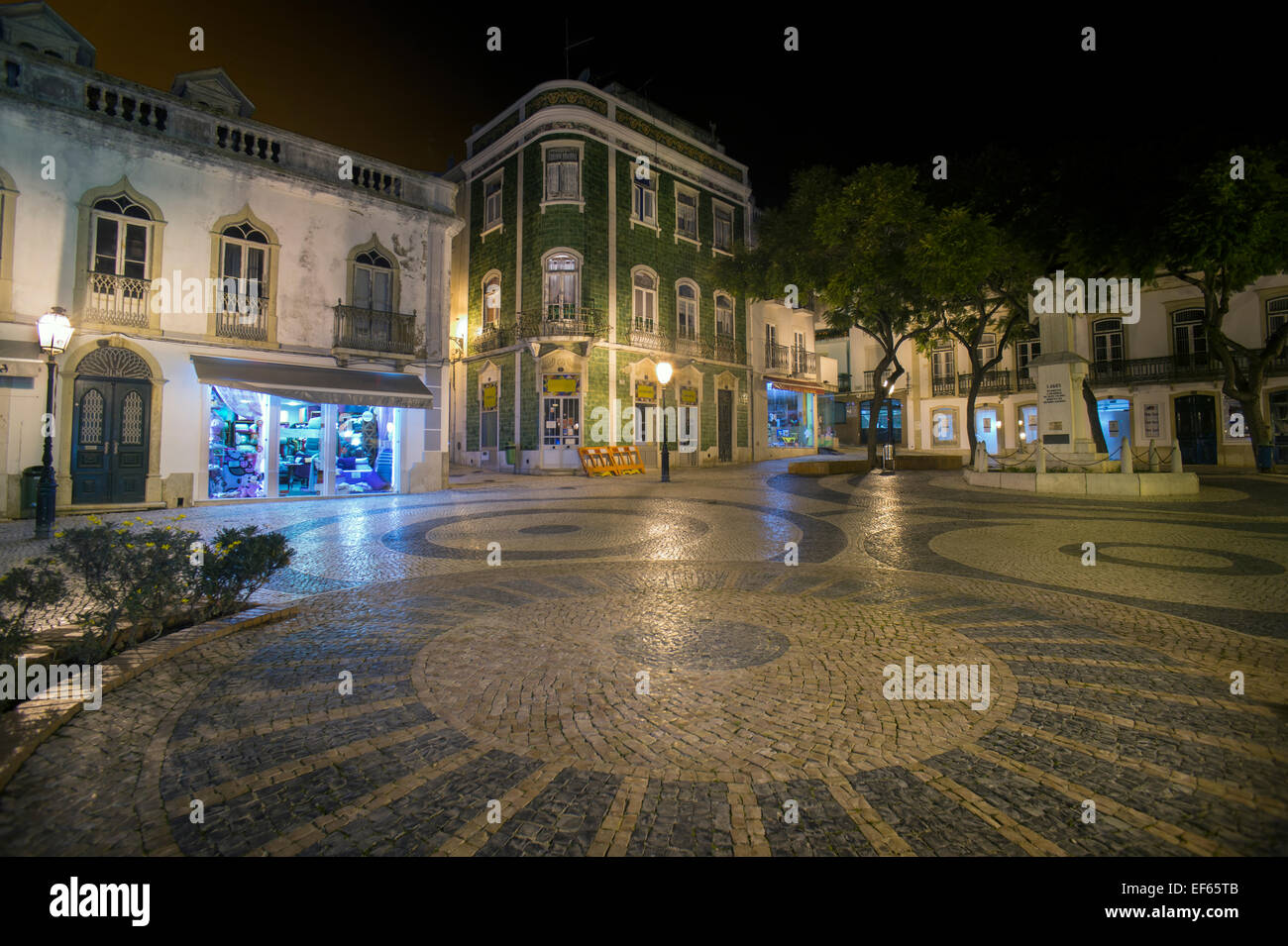 Town square at night in Lagos, Portugal with traditional green tiled