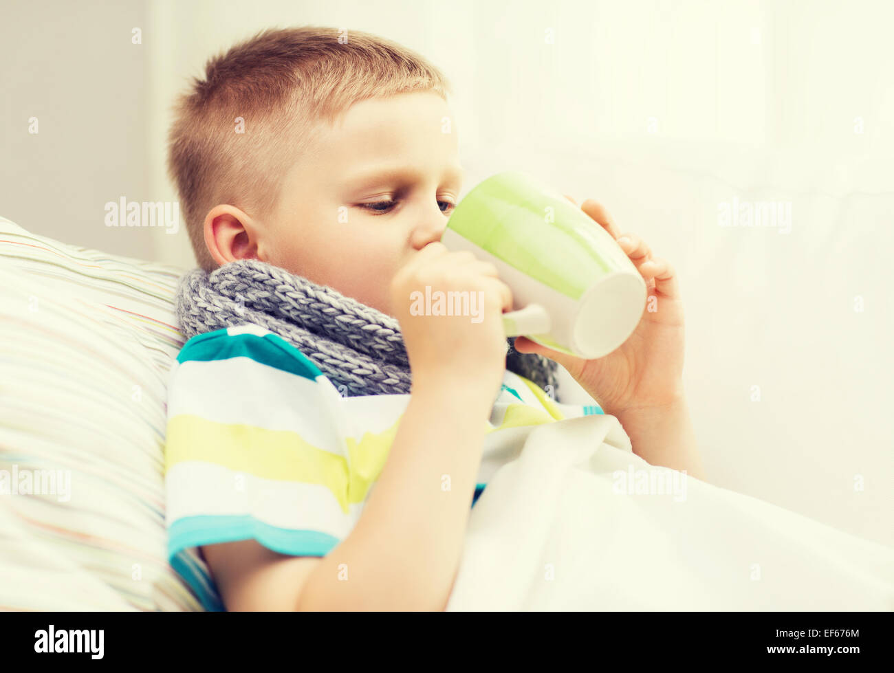 ill boy with flu at home Stock Photo