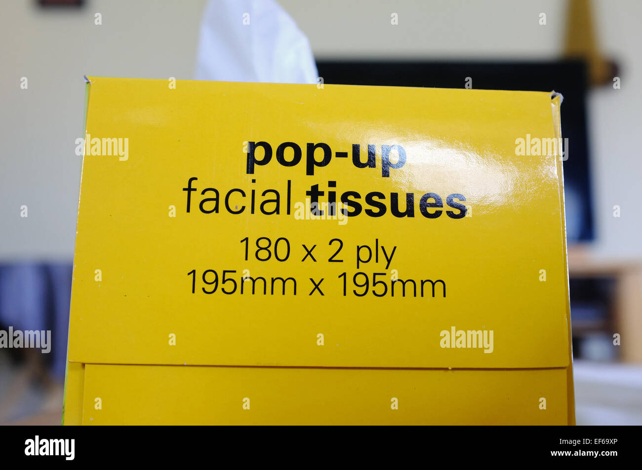 'The side of a yellow box of facial tissues. Stock Photo