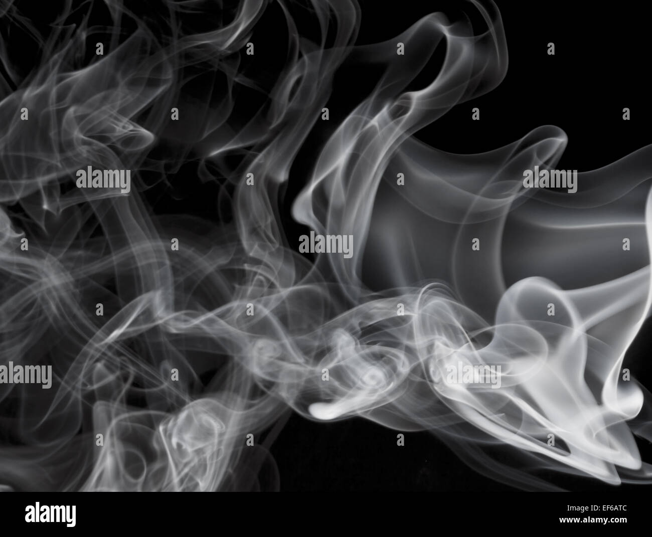 Grey smoke on black background Stock Photo