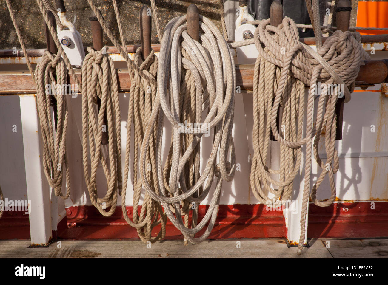 Ropes aboard a sailing ship in a neat orderly tie Stock Photo Alamy