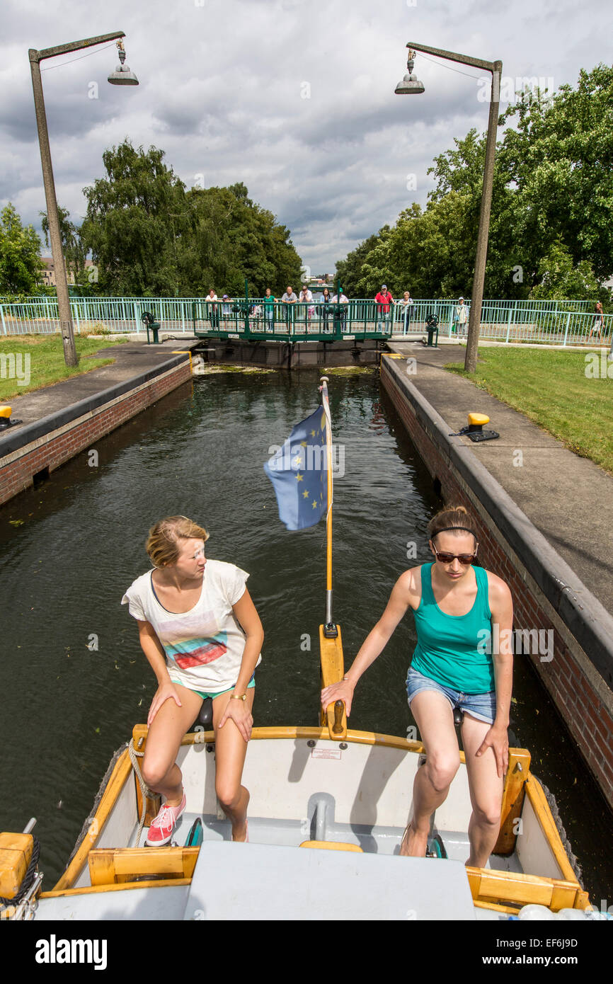 Pedal boat, houseboat 'Escargot', self driven boat with accommodation for 4 people on river Ruhr, passing a lock Stock Photo