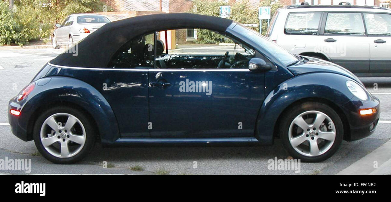 Convertible car volkswagen beetle driving hi-res stock