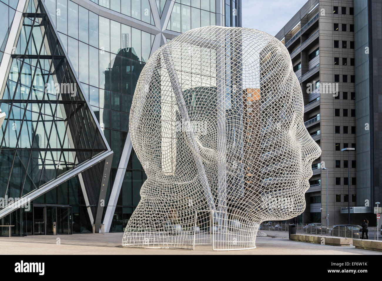 Sculpture titled "Wonderland" by Jaume Plensa. The Bow Tower, Calgary, Alberta, Canada Stock Photo