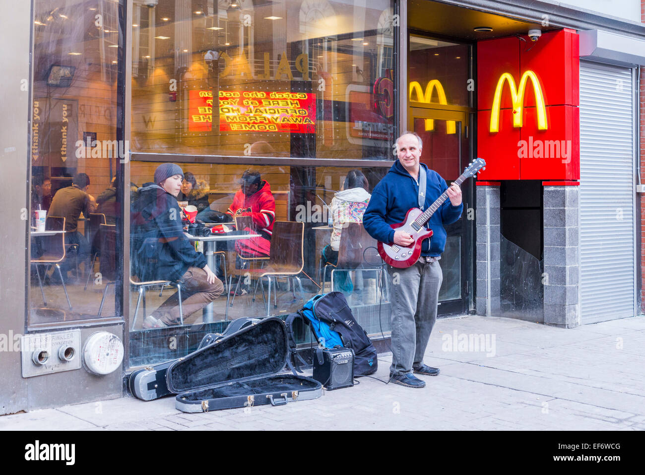 Guitarist busking outside McDonalds on Stephen Avenue, Calgary, Alberta