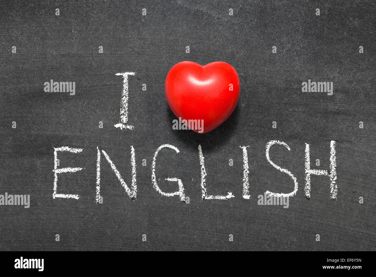 I love english phrase handwritten on blackboard with heart symbol instead of O Stock Photo