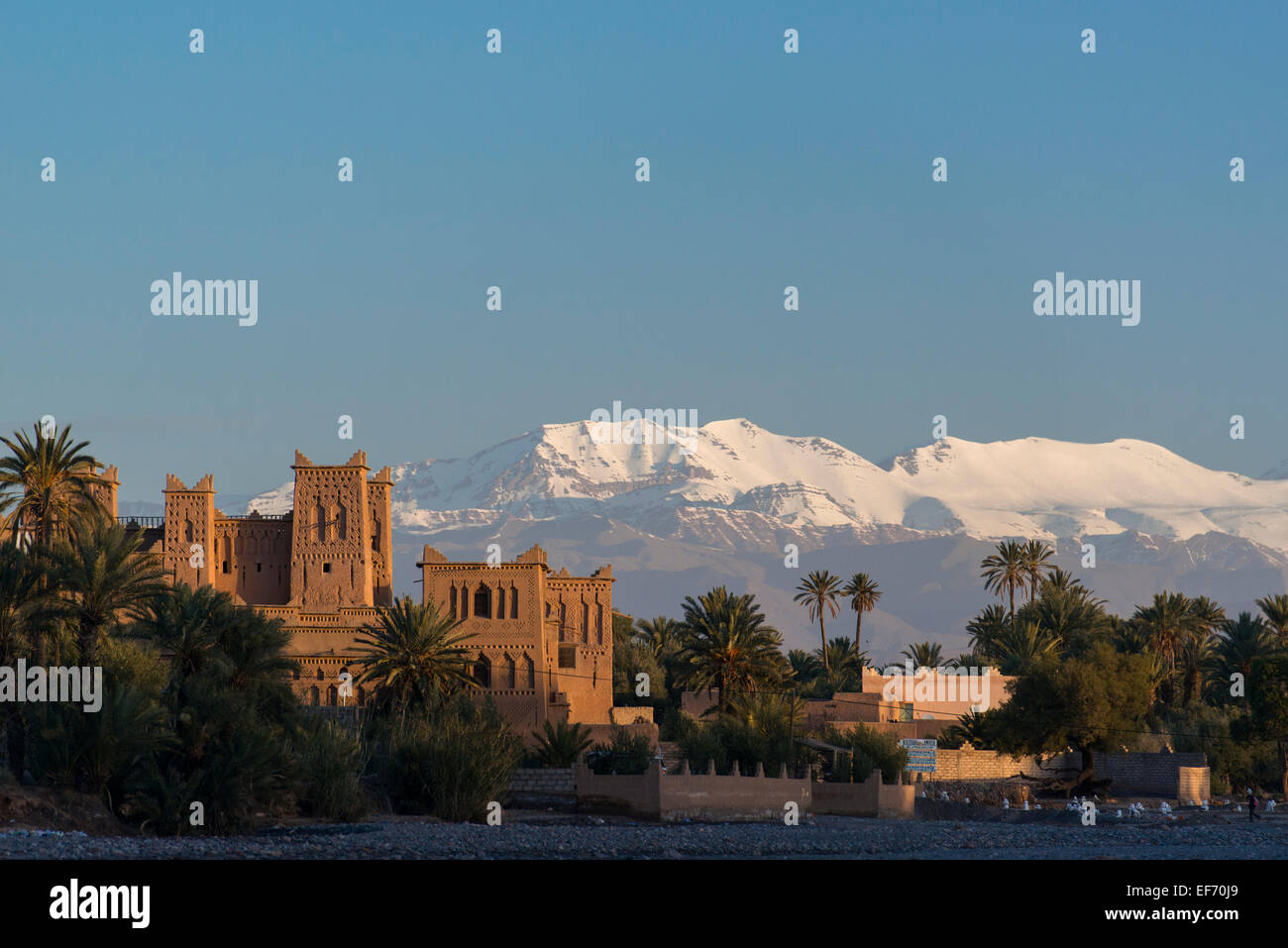 Kasbah Amerhidil in the oasis town of Skoura, Morocco, backdropped by the Atlas Mountains Stock Photo
