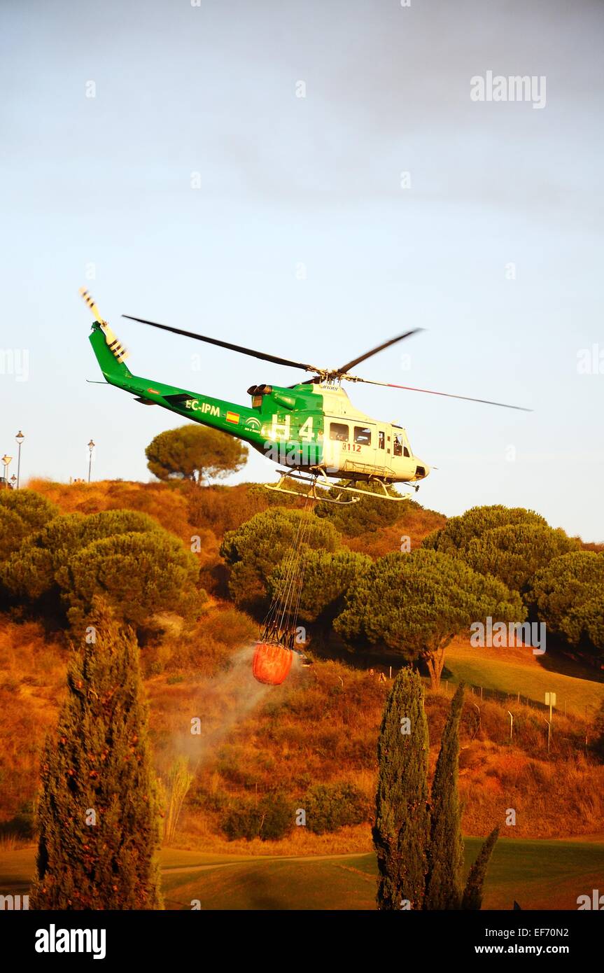 Bell 412 registration EC-IPM collecting water for fire fighting from a ...