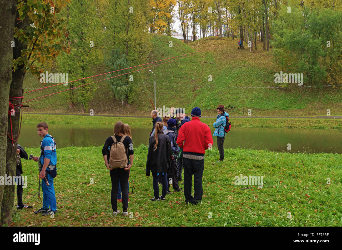 World Tourism Day - sport tourism competition in park on the river Vitba, Vitebsk, inclined crossing on ropes through the river. Stock Photo