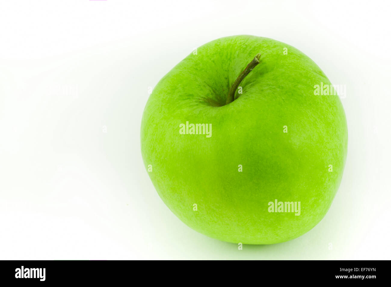green apple isolated on a white background Stock Photo - Alamy