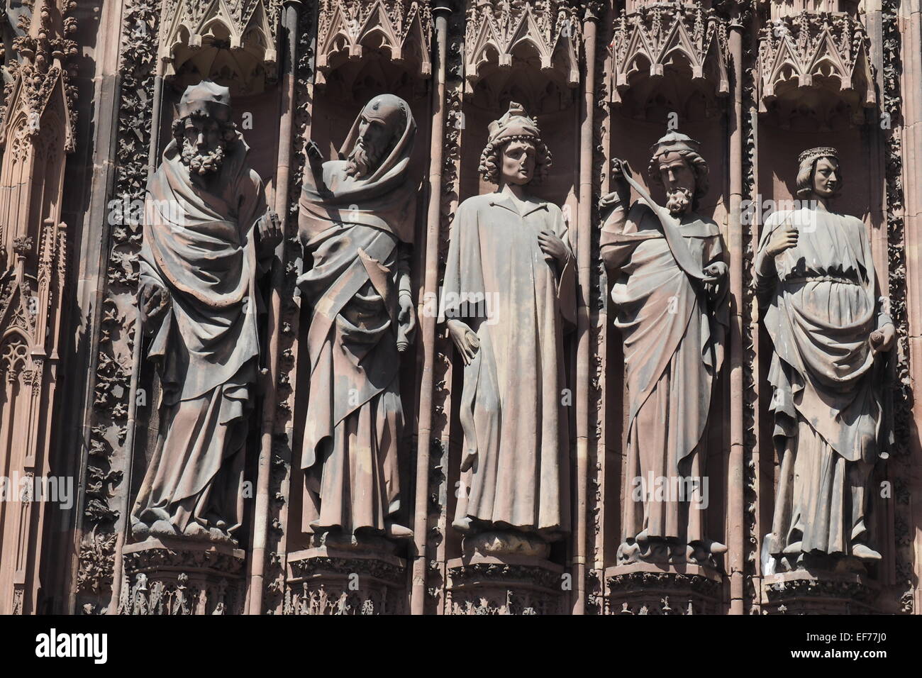 Statues of five Apostles on the front facade of Strasbourg Cathedral. Stock Photo