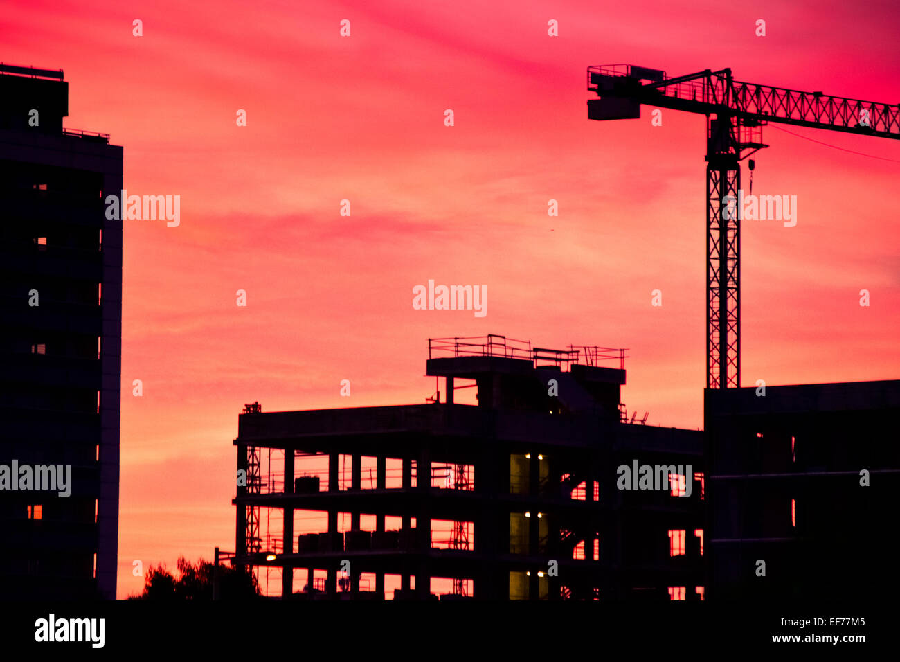 Building under construction at dusk. Stock Photo