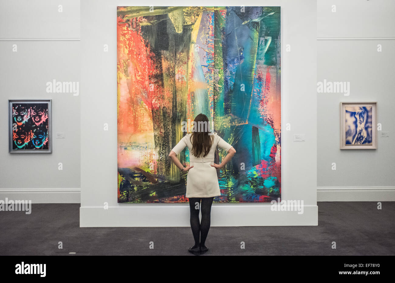 London, UK. 28th January, 2015. a Sotheby’s employee looks at ‘Abstraktes Bild’ by Gerhard Richter (est. £14-20m)  during the press view of the Impressionist & Modern, Surrealist and Contemporary Art sale together estimated at over £233 million Credit:  Piero Cruciatti/Alamy Live News Stock Photo