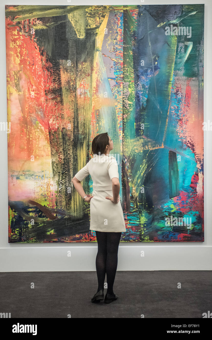 London, UK. 28th January, 2015. a Sotheby’s employee looks at ‘Abstraktes Bild’ by Gerhard Richter (est. £14-20m)  during the press view of the Impressionist & Modern, Surrealist and Contemporary Art sale together estimated at over £233 million Credit:  Piero Cruciatti/Alamy Live News Stock Photo