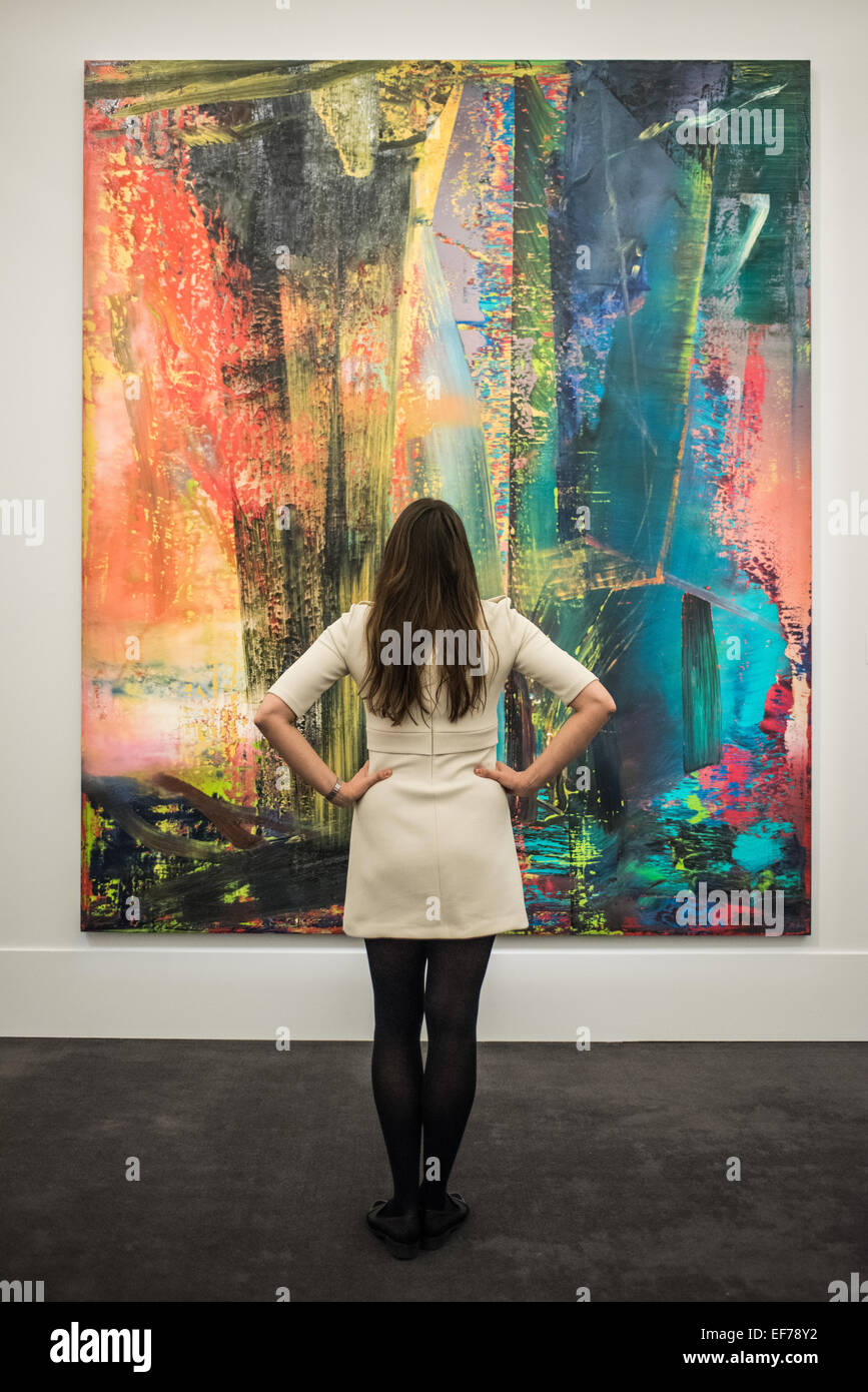 London, UK. 28th January, 2015. a Sotheby’s employee looks at ‘Abstraktes Bild’ by Gerhard Richter (est. £14-20m)  during the press view of the Impressionist & Modern, Surrealist and Contemporary Art sale together estimated at over £233 million Credit:  Piero Cruciatti/Alamy Live News Stock Photo