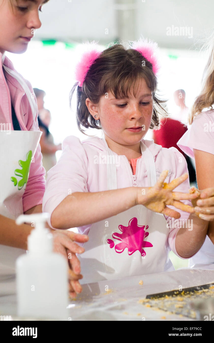 Girl learning how to bake in a cookery class at Children's Food