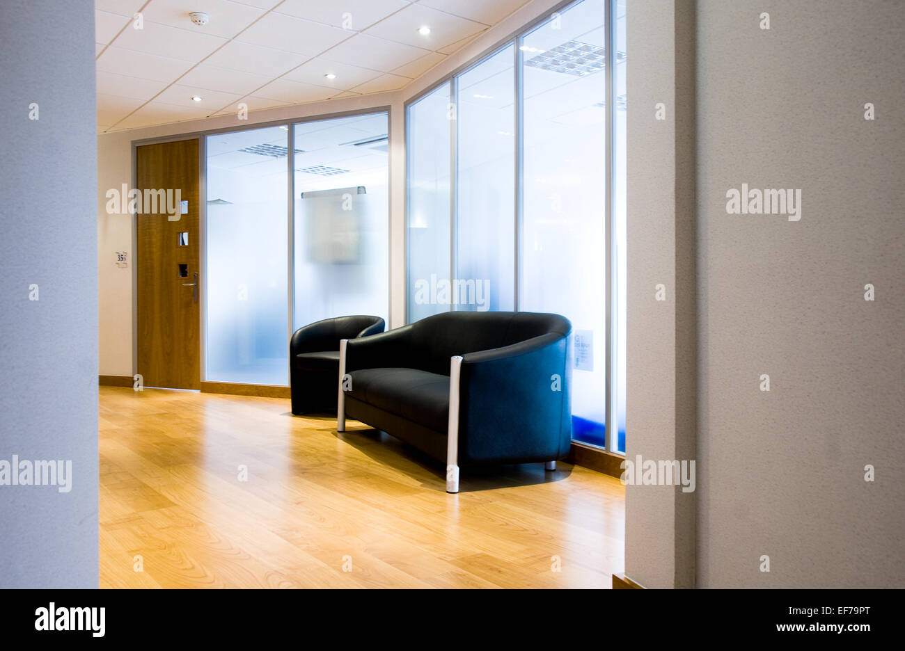 Office interior with waiting area with sofa Stock Photo Alamy