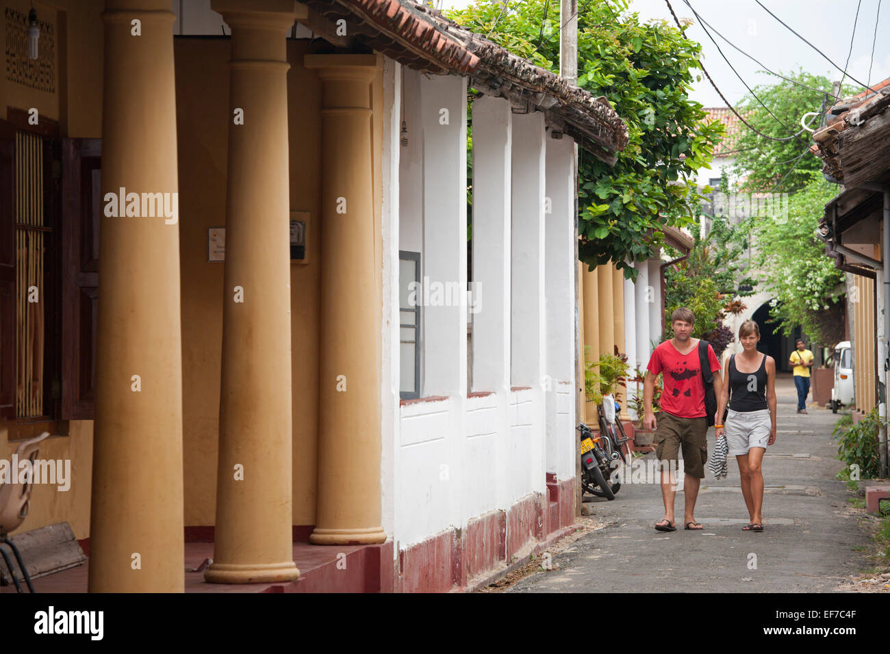 TOURISTS WALKING IN COLONIAL STREET IN GALLE FORT Stock Photo